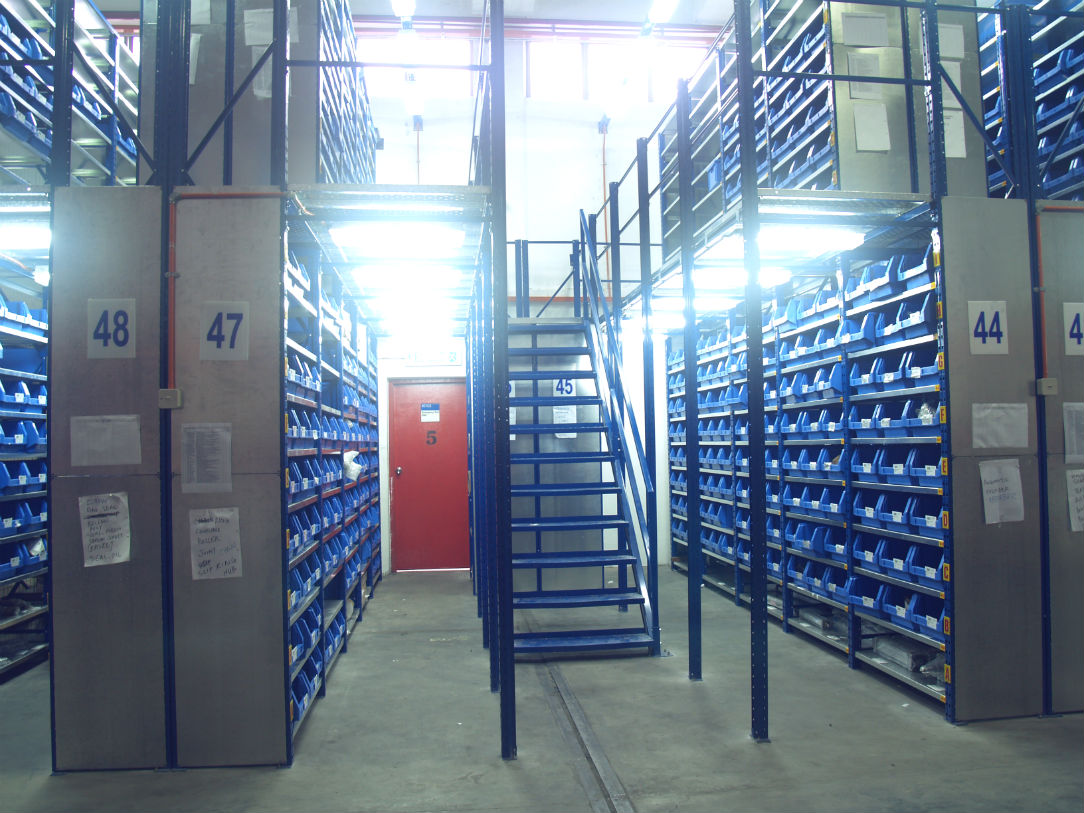 Image of Nutech Modular Multi-tier Racking and the access to first floor via a customized staircase. 