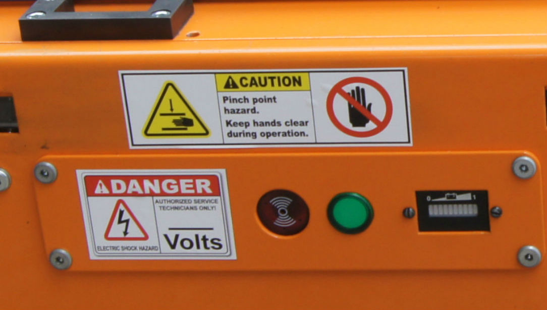 Image of Regulatory signage and Battery Fuel Gauge on Nutech Pallet Shuttle aka. Radio Shuttle or Pallet Carrier. 